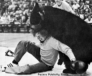 Illustration for article titled This is history's greatest photo of a bear beating up a man